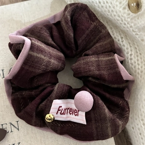 Pink and red checkered scrunchie with Furrever label and gold Luck charm accessory