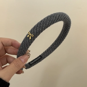 Handmade grey twill knit headband with a golden metal bow, elegant retro hair accessory