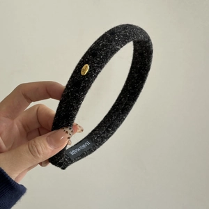 Chic French tweed headband in black and white with a gold logo and handmade label