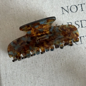 Classic large acetate hair claw clip with blue and brown tortoiseshell pattern
