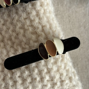Vintage velvet hair clip with colorful oval resin charms on beige knitted background