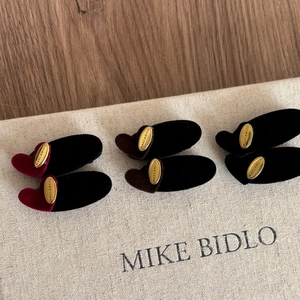 Three pairs of vintage velvet heart hair clips in red, brown and black with gold accents
