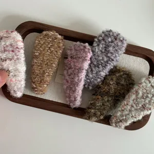 Set of 6 triangular faux shearling hair clips in assorted warm autumn colors