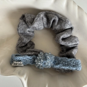 Detailed shot of grey knit scrunchie and blue crochet band with crystal beads