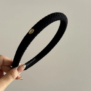 Classic black knitted padded headband with golden Wings logo in French vintage style