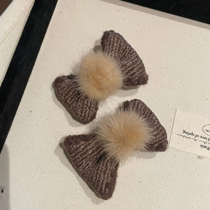 Pair of brown knitted bow hair clips with soft fur balls for little girls