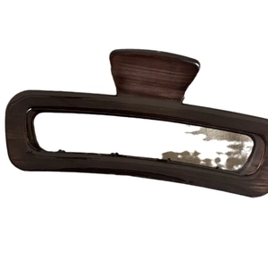 Deep brown large rectangular hair claw clip with vintage wood grain texture on white background