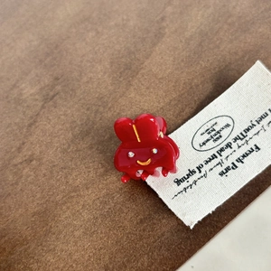 Pince à cheveux lapin rouge avec strass et finition brillante pour coiffure femme