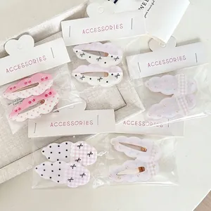 Dolci fermagli per capelli a forma di nuvola con pois, fiocchi e motivi floreali