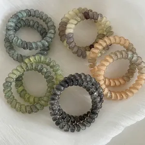 Five pieces of gradient spiral telephone wire hair ties in minimalist Morandi color tones