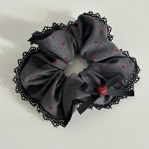 Polka dot satin scrunchie with lace edge, black bow and red heart charm pendant