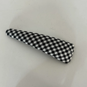 Classic black and white houndstooth pattern hair clip with a fabric wrapped design