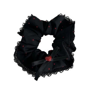 Red polka dot satin scrunchie with black lace trim and heart bow decoration