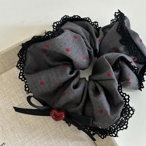 Grey hair scrunchie with red polka dots, black lace trim, and a heart pendant charm