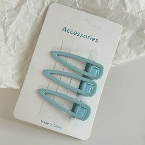 Lot de trois barrettes à cheveux goutte d'eau bleu clair sur carton de présentation