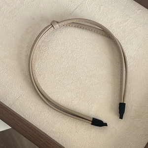 Minimalist double-strand knotted PU leather headband in beige with fine stitching details