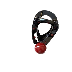 Elegant black heart-shaped hair claw clip with large red pearl and rhinestone accents
