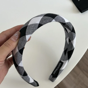 Classic black and white houndstooth headband with handmade label for women's hair styling