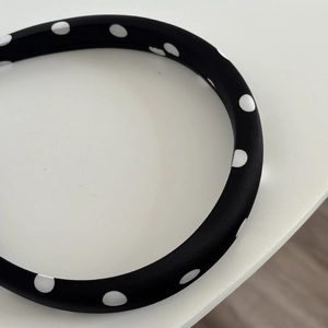 Polka dot satin padded headband in black and white with a classic vintage French style
