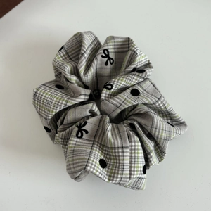 Retro grey and white plaid scrunchie with black polka dots and bows for a stylish high ponytail
