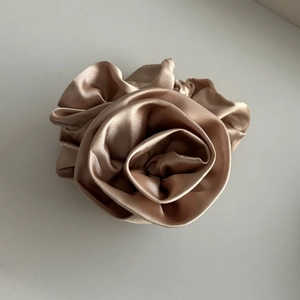 Elegant champagne satin silk hair scrunchie shaped like a rose flower for women