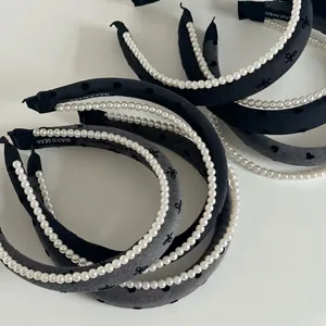 Elegant grey double-layered pearl headband with textured fabric and handmade detail