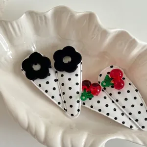 Cute 4-piece hair clip set with floral polka dots and red 3D cherries for girls