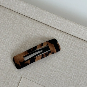 Rectangle leopard print BB hair clip with black fabric wrap for stylish hair styling