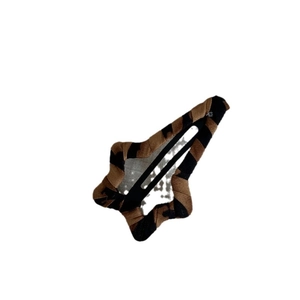Star shaped BB hair clip with brown and black striped fabric on a metal base