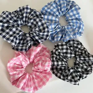 Set of sweet plaid fabric scrunchies in black, white, blue and pink patterns