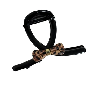Leopard print bow hair claw clip with black glossy finish and gold metal fastener
