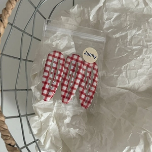 Three-piece set of red and white plaid water-drop BB hair clips in a clear pouch
