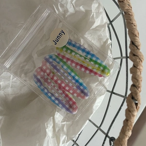 Detailed view of colorful plaid wavy BB hair clips set in transparent packaging