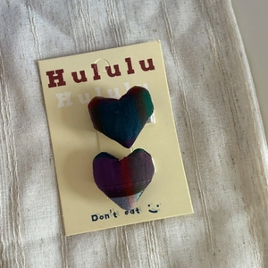 Set of two colorful plaid fabric heart hair clips for girls on display card