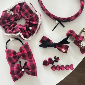 Pink plaid hair accessory set including scrunchies, bows, and clips with lace details