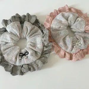 Rainbow lace oversized scrunchies with bow and pearl detail in blue and pink pastel colors