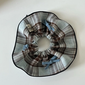 Blue plaid scrunchie with cute denim bows and heart patterns on a white background