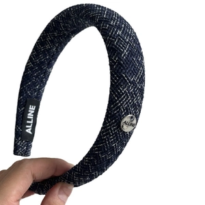 Blue and white tweed padded headband with silver metallic logo plate and label