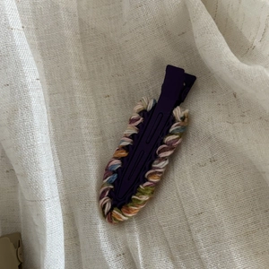 Handmade woven woolen hair clip with colorful yarn wrap on purple metal hair pin