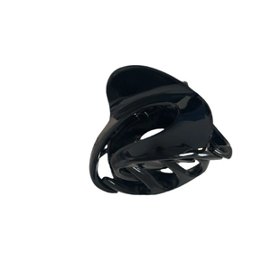 Glossy black irregular pumpkin hair claw clip for women with minimalist wave design