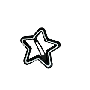Minimalist star-shaped hair clip with black wavy border and white star patch design