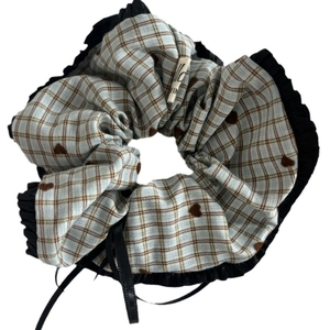 Blue and brown plaid scrunchie with heart pattern, black ruffle trim and satin ribbon