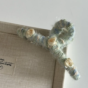 Mint green knitted hair claw clip featuring delicate white silk roses for women's hair