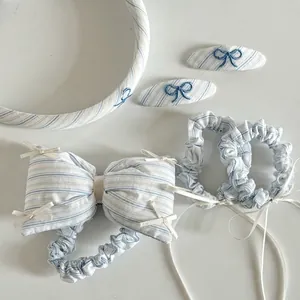Blue and white striped fabric hair accessory set with embroidered bow clips and scrunchies