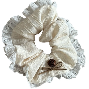 Elegant off-white scrunchie with lace edge, brown satin rose and suede bow detail