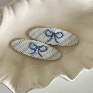 Blue striped oval hair clips set with elegant navy bow embroidery for women