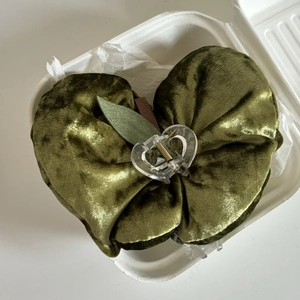 Olive green velvet apple shaped hair claw clip with leaf detail for elegant hairstyles