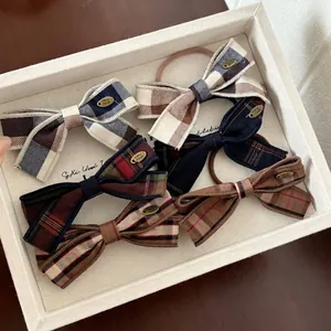 Five-piece set of plaid bow hair ties featuring vintage patterns and handmade metal tags