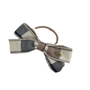 Plaid pattern bow hair tie with a gold 'Hand Made' plaque and brown elastic band