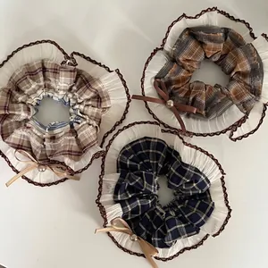 Three-piece set of vintage plaid scrunchies with lace trim and elegant pearl bow accents